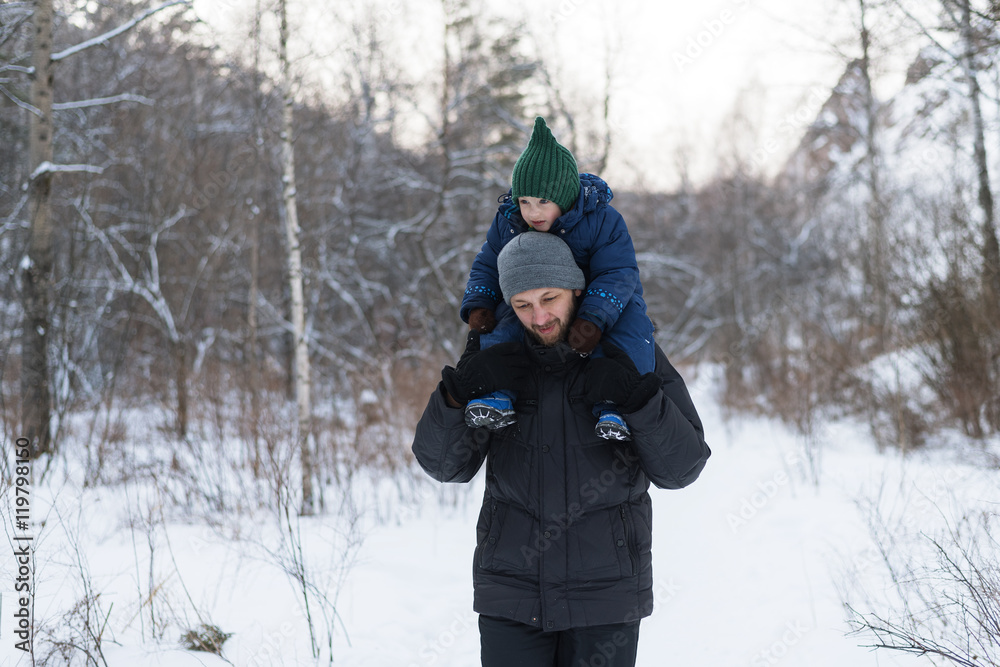 Father and child in a winter forest Father and child in a winter forest
