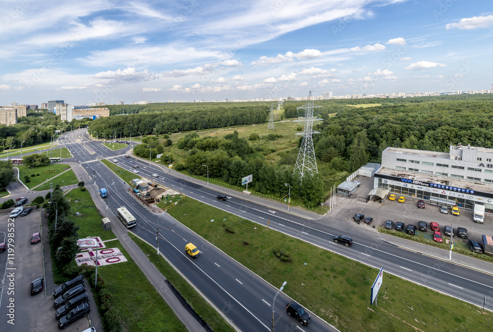 A new residential area of ​​Moscow. The road and the forest
