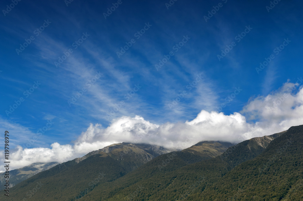Cloudy blue sky and mountains in Otago region, south island of New Zealand