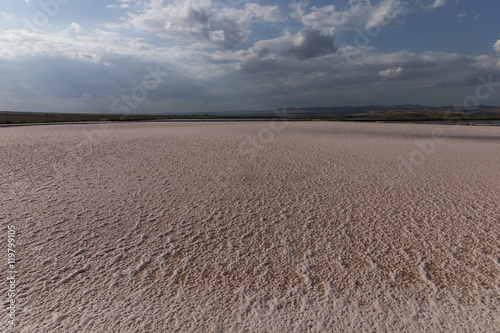 Pool of pink salt water for salt production.