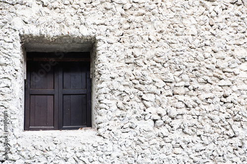 old window and stone wall photo