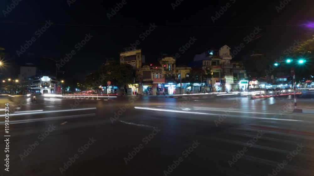 Timelapse of night city Hanoi, Vietnam. Seen busy road with passing cars and buildings with illumination Timelapse of night city Hanoi, Vietnam. Seen busy road with passing cars and buildings with illumination