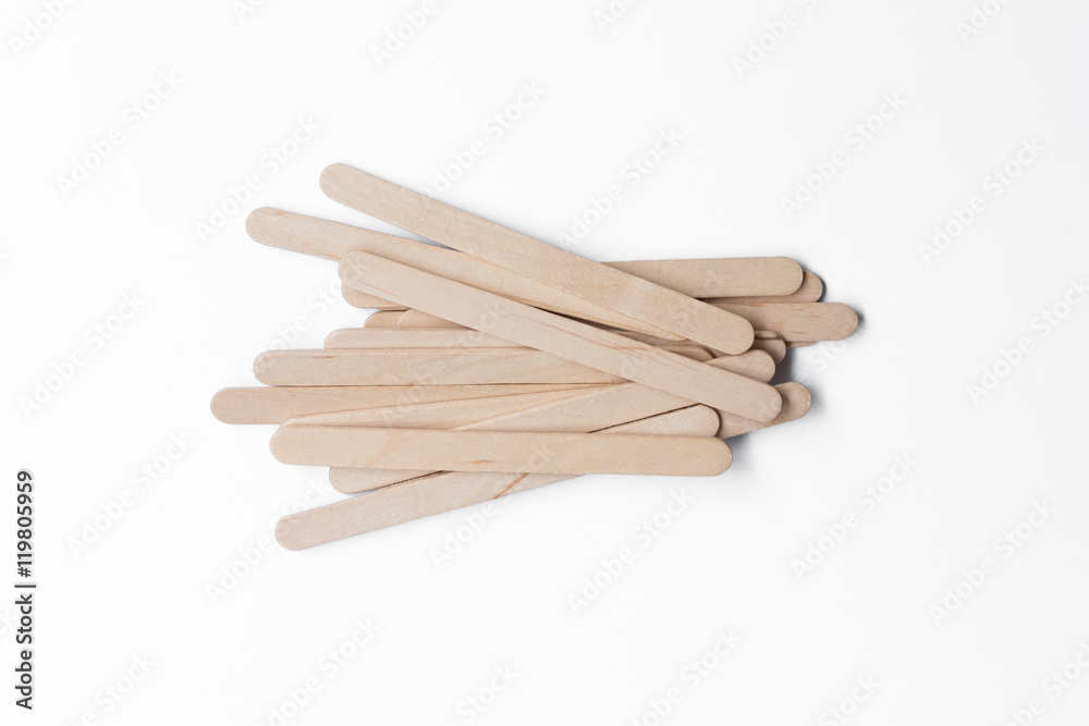 Wooden ice-cream sticks on white background.. Wooden ice-cream sticks on white background..