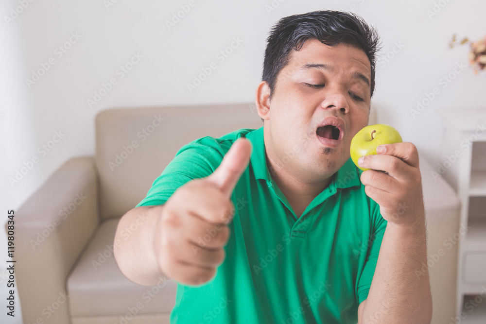 obese man trying to eat healthy fresh food obese man trying to eat healthy fresh food
