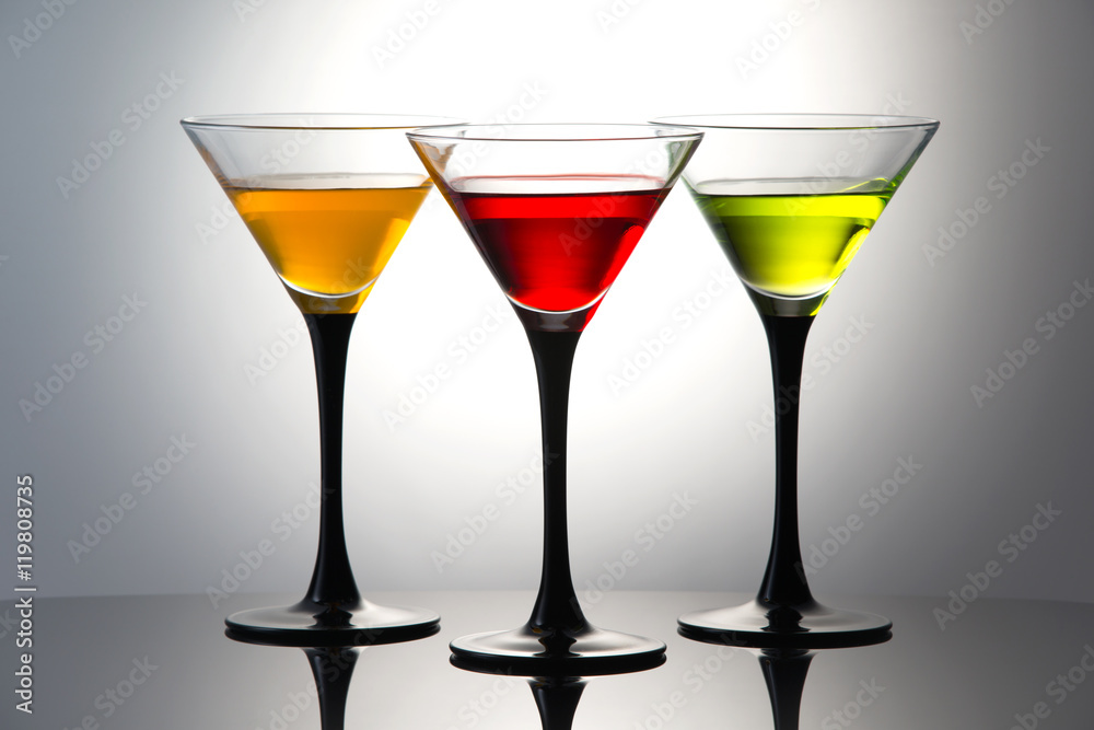 Colored drinks in martini glasses, cocktails with liqueurs