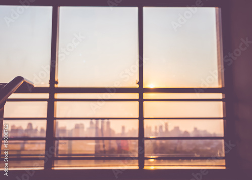 Blurred background looking up at window in sunset time to city v