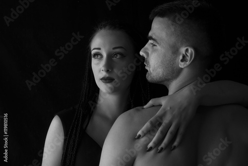 Two lovers over dark background
