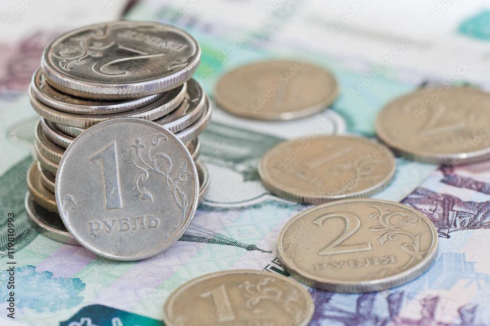 rubles coins against background of 1000 and 500 rubles banknotes rubles coins against background of 1000 and 500 rubles banknotes