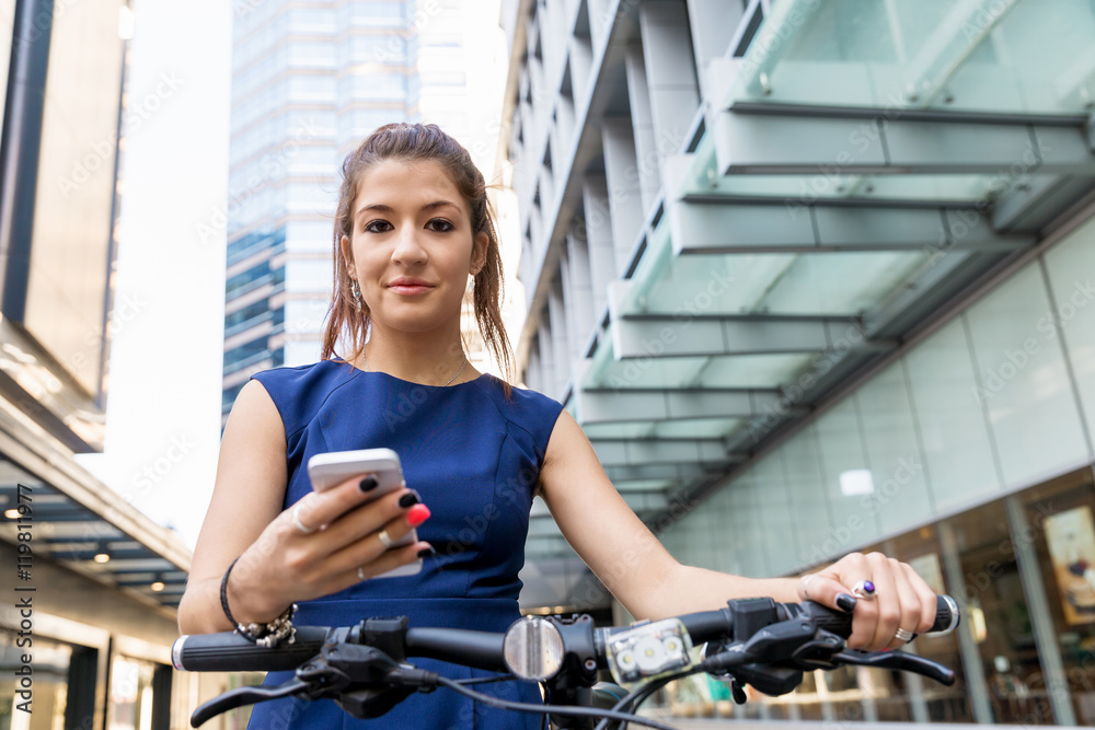 Young woman commuting on bicycle Young woman commuting on bicycle