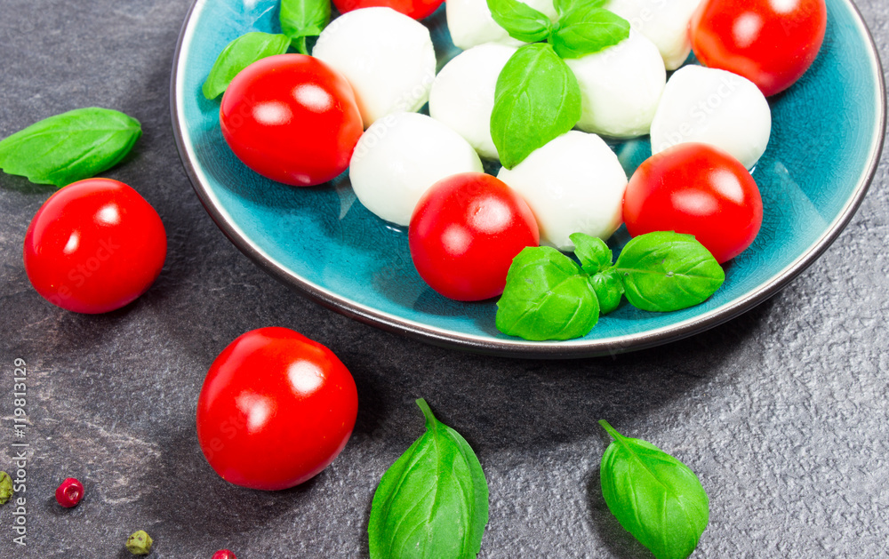 Salad with mozzarella, tomatoes and basil Salad with mozzarella, tomatoes and basil