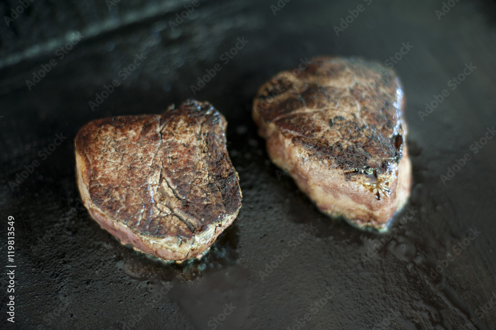 Cooking two medallions of fillet steak Cooking two medallions of fillet steak