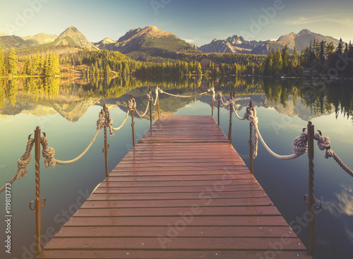 High resolution panorama of the lake in Strbske Pleso,High Tatras,Slovakia.Toned with a retro vintage  effect
 photo