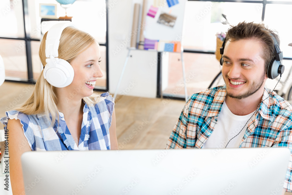 Young office workers with headphones Young office workers with headphones