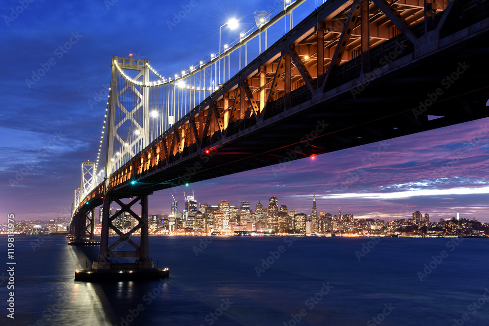 Fototapeta premium San Francisco skyline framed by the Bay Bridge at sunset