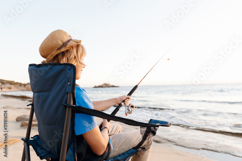 Teenage boy fishing at sea