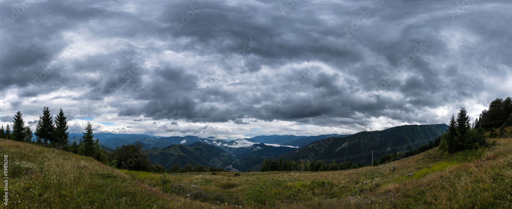 Dark clouds over a valley in the Carpathians mountains