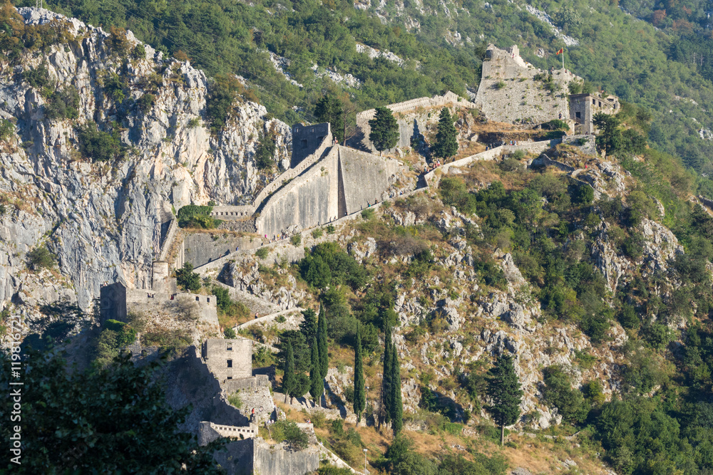 View of unknown people climbing the Kotor Fortress walls from the City, Kotor, Montenegro