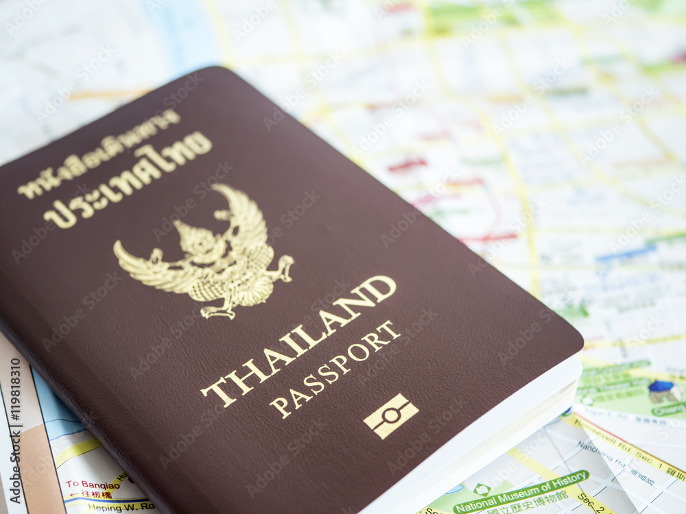 Thailand passport on paper map 1 Thailand passport on paper map 1