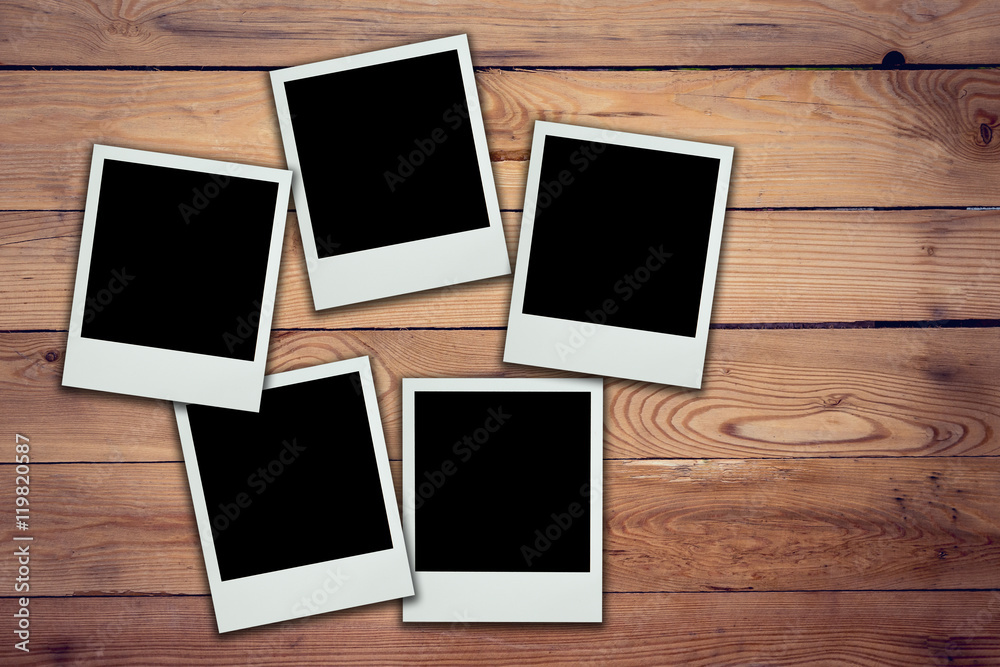 Blank photo frame on wood background and texture Blank photo frame on wood background and texture