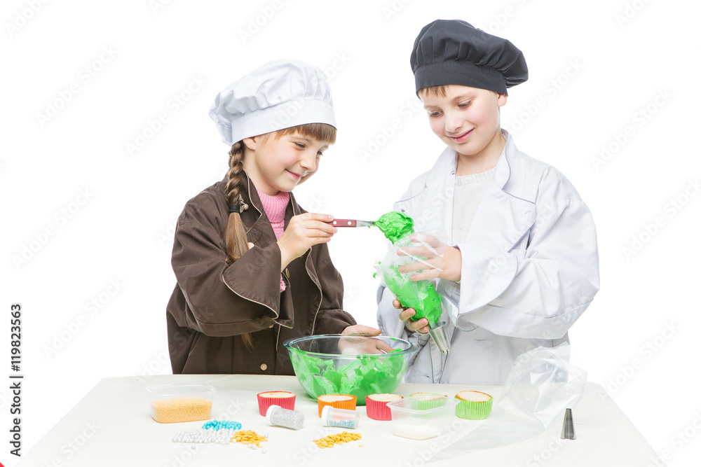 Children making christmas cupcakes Children making christmas cupcakes