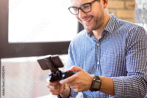 Cheerful man playing video games.