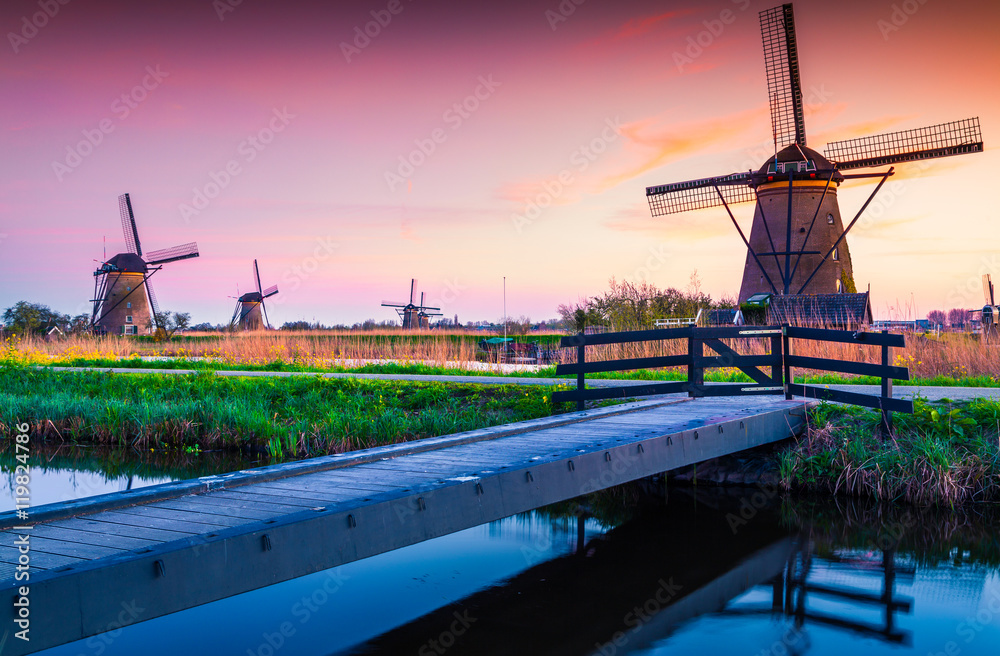 Colorful spring scene in the famoust Kinderdijk canals with wind Colorful spring scene in the famoust Kinderdijk canals with wind