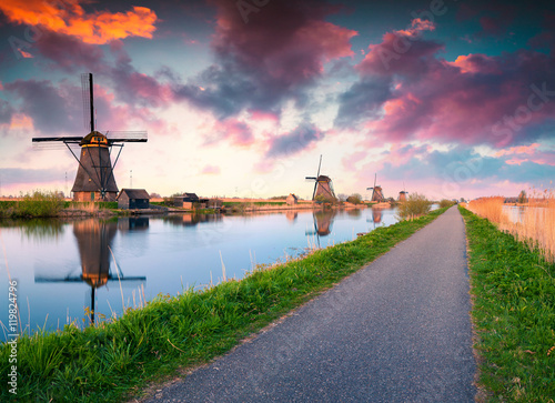 Colorful spring scene in the famous Kinderdijk canals with windm photo