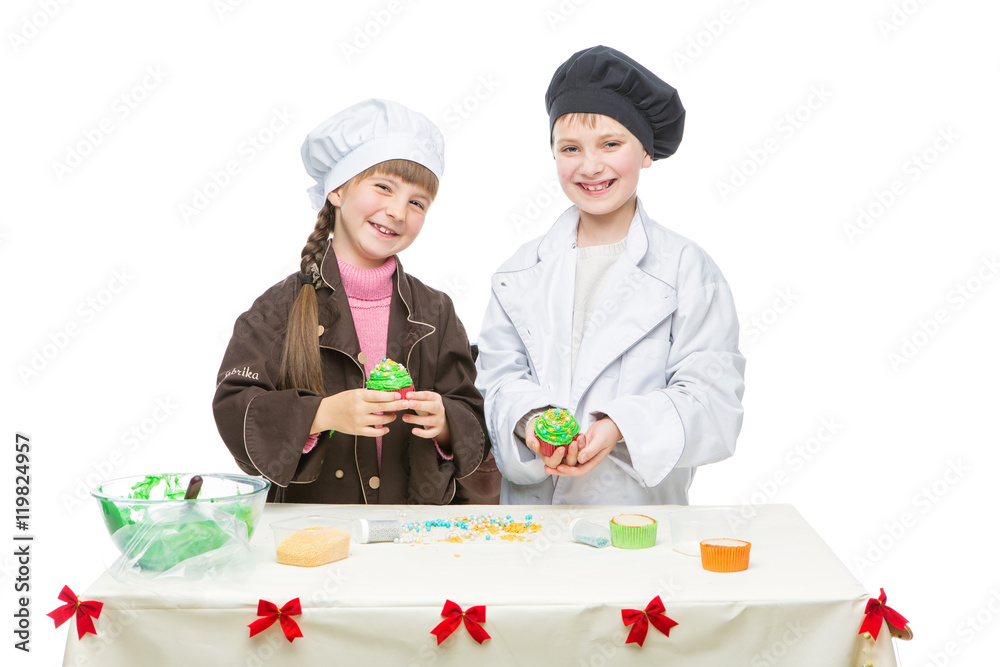 Children making christmas cupcakes Children making christmas cupcakes