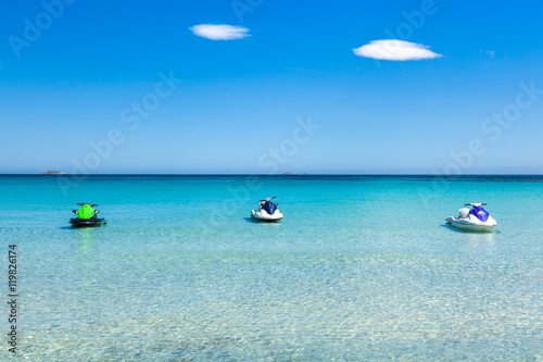 Jet ski mooring in the turquoise water of  Rondinara beach in Co © Samuel B.