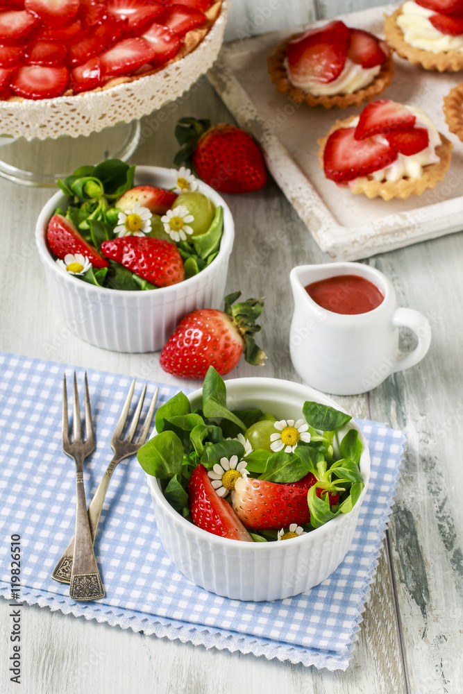 Healthy salad with lamb's lettuce (Valerianella locusta), strawb Healthy salad with lamb's lettuce (Valerianella locusta), strawb