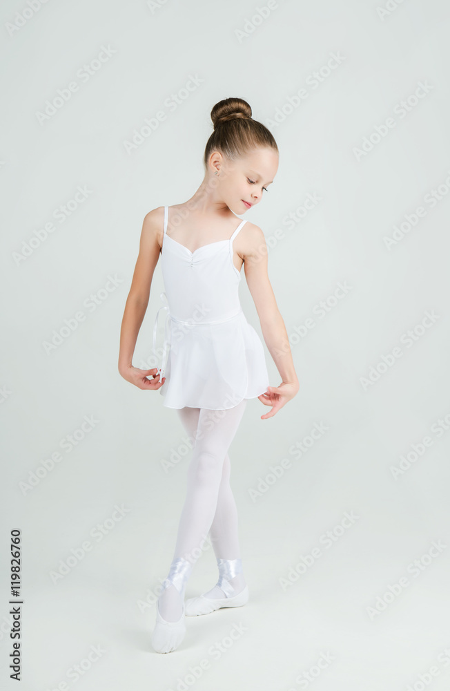 A little adorable young ballerina poses on camera A little adorable young ballerina poses on camera