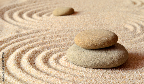 stones on the sand with circles