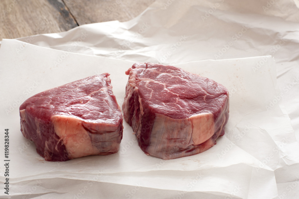 raw joints of beef on butchers paper raw joints of beef on butchers paper
