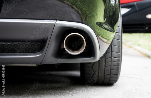 Obraz na plátne Sport Car muffler in the back of a black luxury sport car.