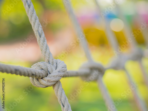 Rope tied in a knot, Children in playground. 