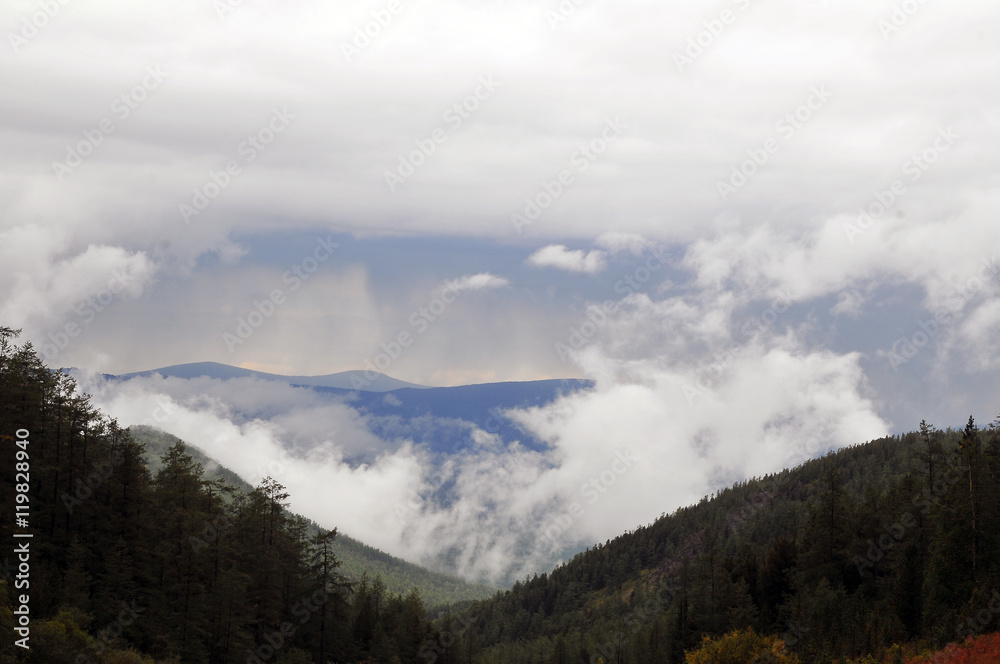 Altay mountains with fog and clouds after rain, Russia, Siberia Altay mountains with fog and clouds after rain, Russia, Siberia