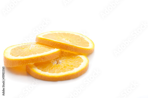 Three slices of fresh yellow juicy lemons