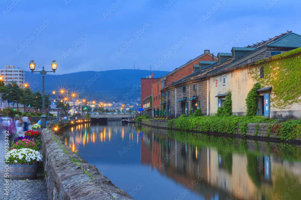 Naklejka premium Otaku, Japan historic canal and warehouse in summer twilight time, famous tourist attraction of Sapporo Hokkaido.