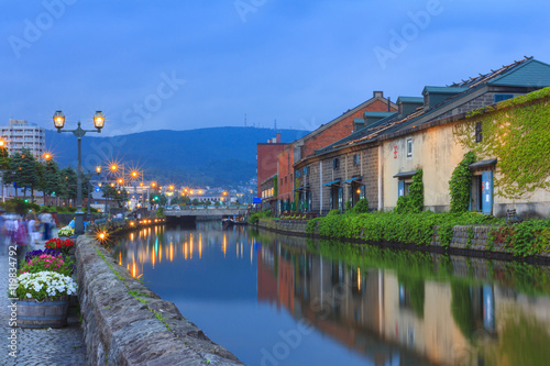 Otaku, Japan historic canal and warehouse in summer twilight time, famous tourist attraction of Sapporo Hokkaido.