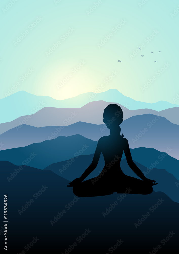 Woman meditating on the mountain
