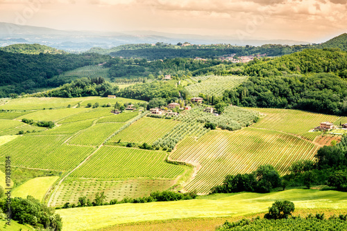 Beautiful tuscan landscape view on the green meadow with farmlands near Montepulciano town in Italy