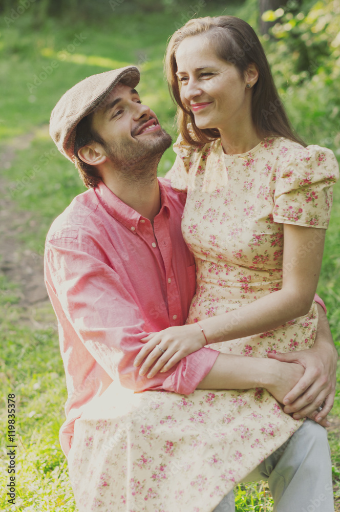 Happy young couple walking in the park Happy young couple walking in the park