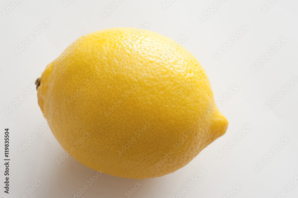 Close-up of yellow lemon on white background Close-up of yellow lemon on white background