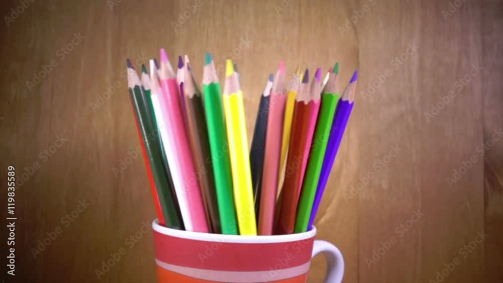 the mug with bright pencils turns.slow motion the mug with bright pencils turns.slow motion