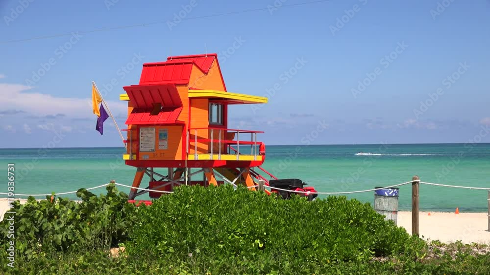 Miami Beach in South Beach with new lifeguard tower and coastline with colorful cloud and blue sky. Florida. Miami Beach in South Beach with new lifeguard tower and coastline with colorful cloud and blue sky. Florida.