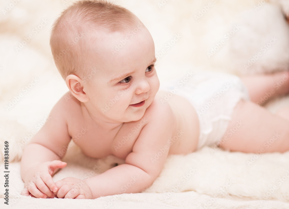 Baby boy, brown eyes, white background, smile Baby boy, brown eyes, white background, smile