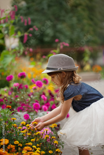 beautiful girl in flowers park © Aliaksei Lasevich