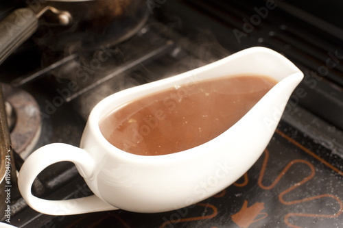 Gravy boat filled with rich hot gravy