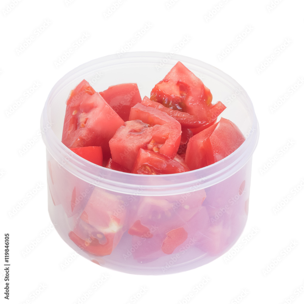 Fresh red tomato slice in plastic box isolated on white background Fresh red tomato slice in plastic box isolated on white background