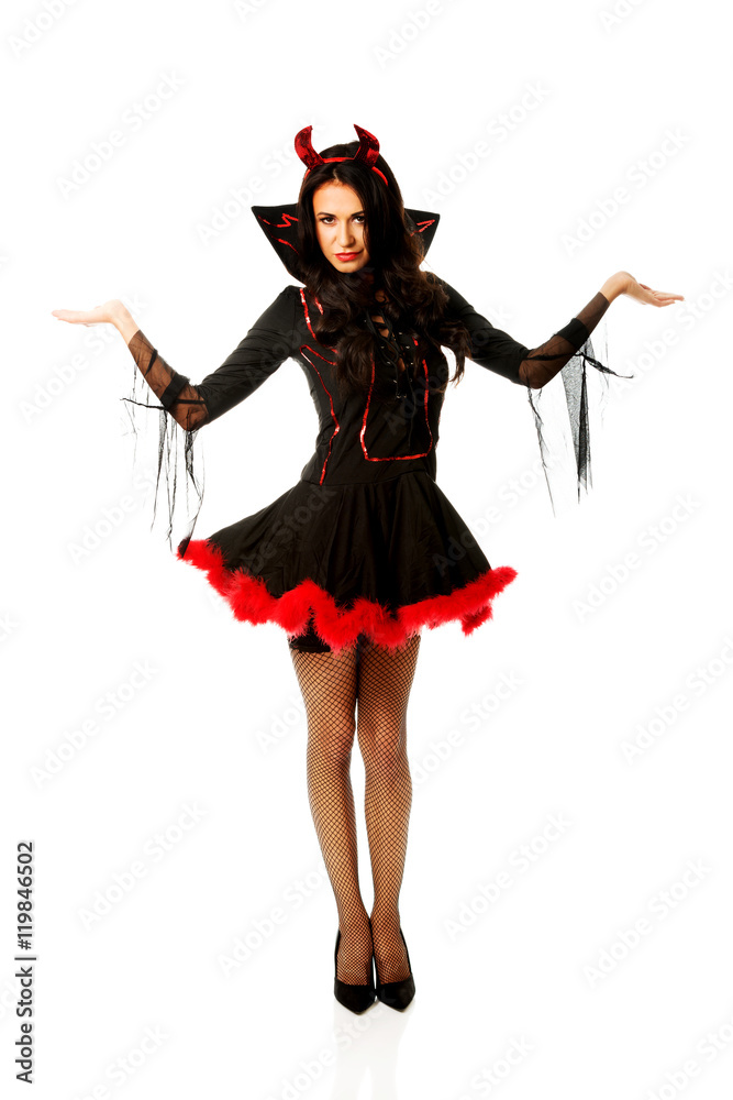 Woman in devil clothes with open hands gesture Woman in devil clothes with open hands gesture